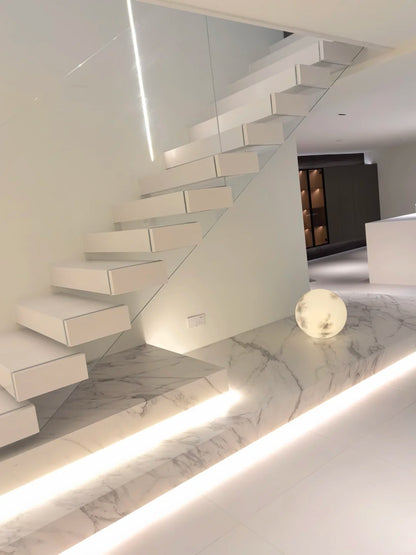 Rothnow® Floating Staircase RNFS05 in black with stone steps, modern design, custom size, installed as a stylish interior staircase.