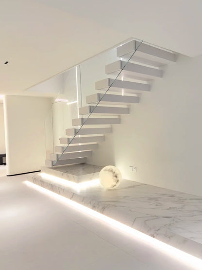 Rothnow® Stone Floating Staircase RNFS05 with black finish, modern staircase design, showcasing sleek floating steps.