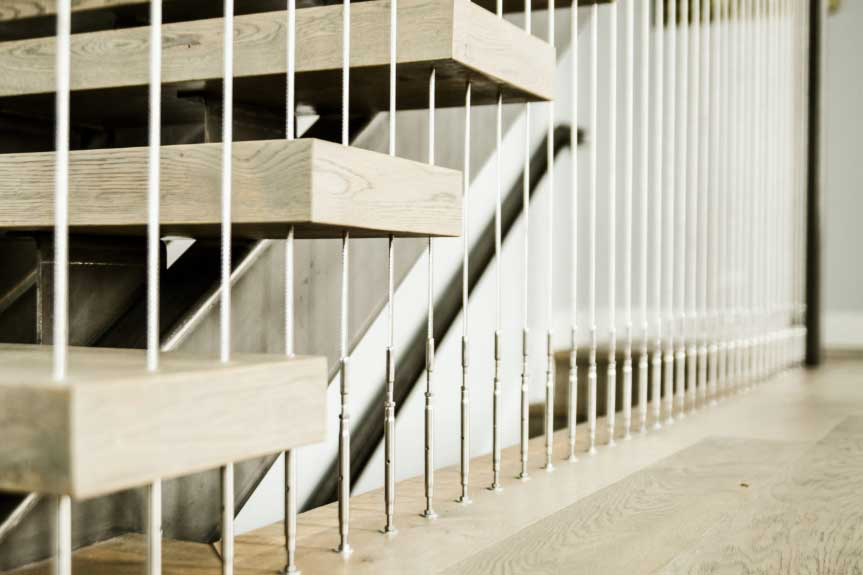 Black Rothnow® floating staircase with cable railing, modern design, featuring custom size and sleek, minimalist aesthetic.