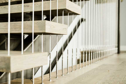 Black Rothnow® floating staircase with cable railing, modern design, featuring custom size and sleek, minimalist aesthetic.