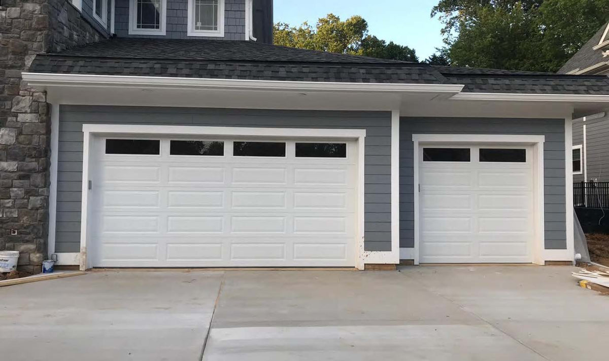 Black Rothnow garage door with steel plate construction and filled PU foam insulation, designed for durability and energy efficiency.