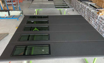 Black Rothnow aluminum garage door with customizable size, featuring a sleek and durable design for residential or commercial use.