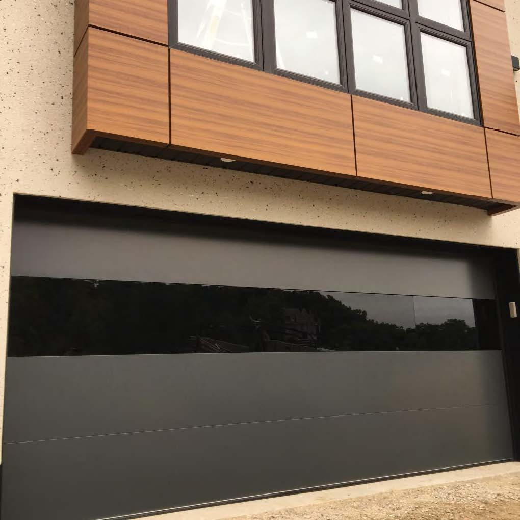 Rothnow full mirror glass garage door with black frame and sleek modern design for enhanced curb appeal and functionality.