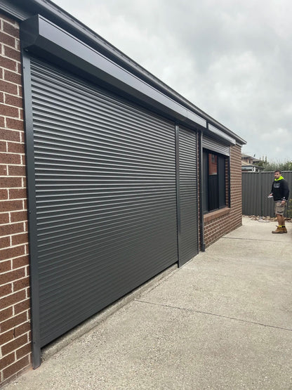 Black Rothnow aluminum roll-up garage door model RNGD08, customized size, featuring sleek aluminum panels for modern garage access.