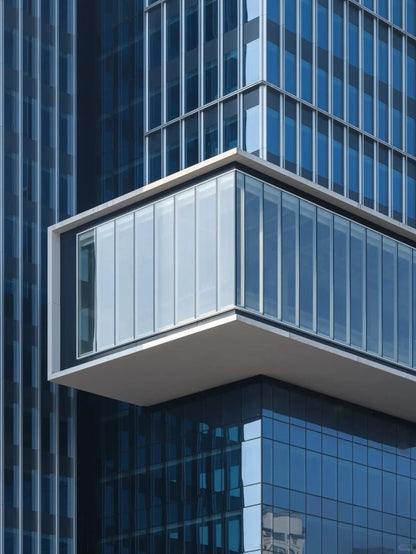 Black Rothnow glass curtain wall with exposed frame, showcasing a sleek, customized window design for modern building facades.