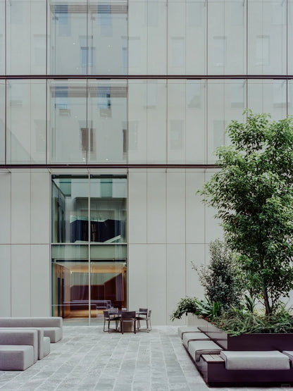 Black Rothnow glass curtain wall with exposed frame, showcasing a custom-sized architectural window for modern building facades.