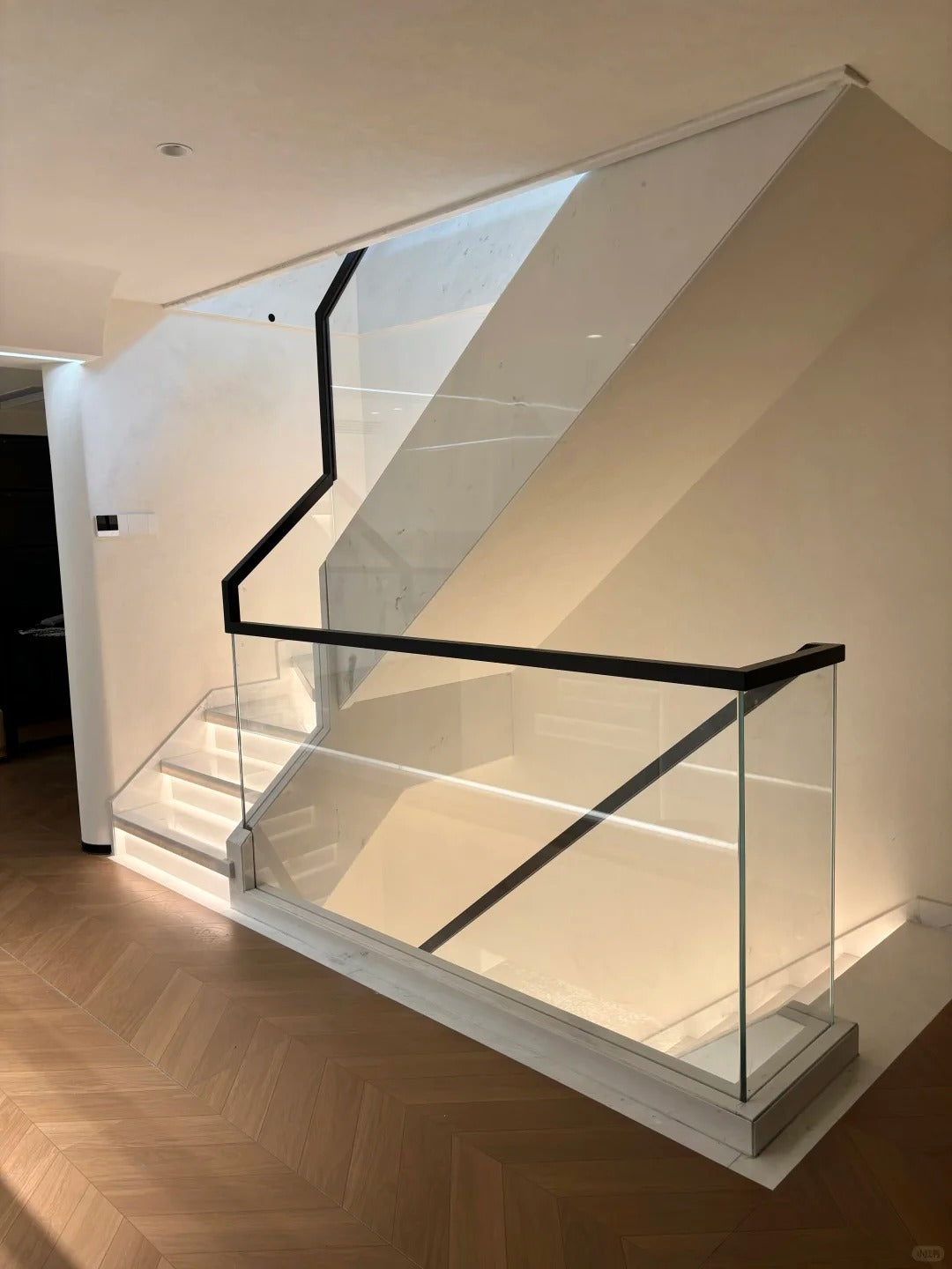 Black Rothnow® glass railing with U-channel design, custom size for modern balcony or deck safety and aesthetic.