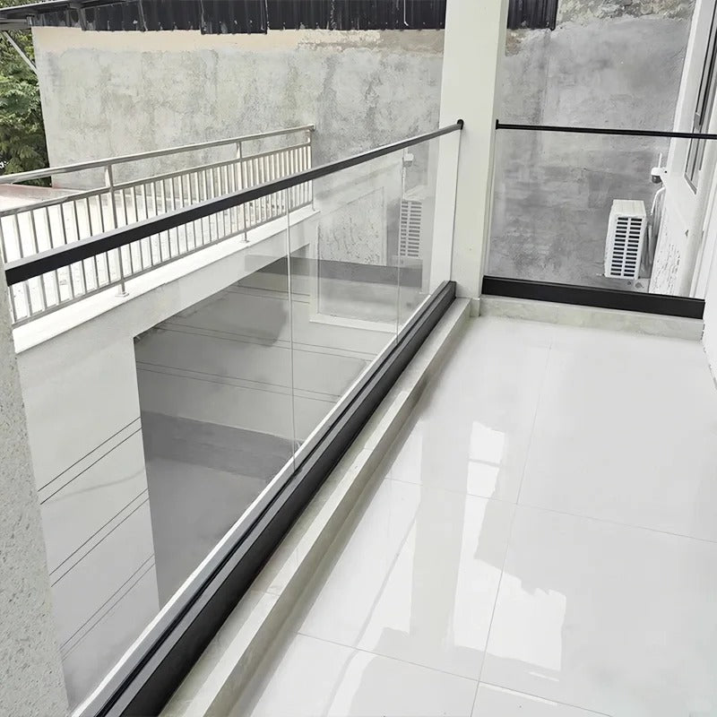 Black Rothnow Glass Railing RNGR02 U-channel with clear glass panels for modern balcony or stairway safety.