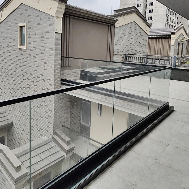 Rothnow glass railing RNGR02-U channel with black finish, showcasing sleek glass panels and sturdy U-channel design for modern safety.