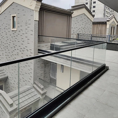 Rothnow glass railing RNGR02-U channel with black finish, showcasing sleek glass panels and sturdy U-channel design for modern safety.