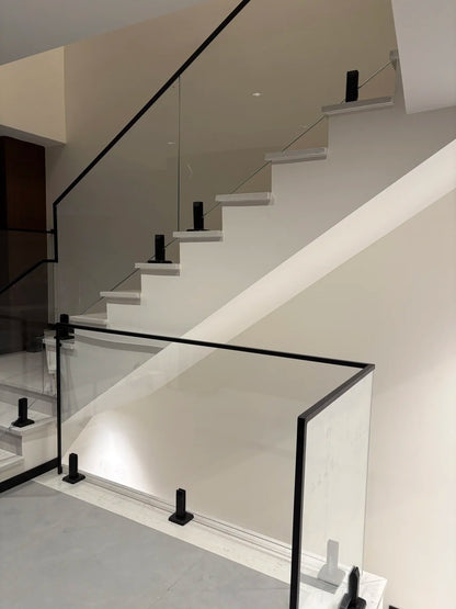 Rothnow Glass Railing RNGR04 with black spigot design, showcasing sleek safety railing system with clear glass panels.
