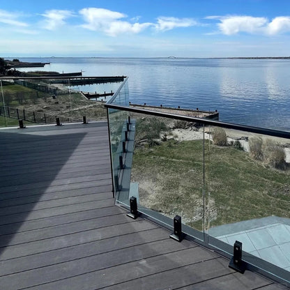 Black Rothnow Glass Railing RNGR04 with spigot fittings, showcasing sleek, customizable safety barrier for modern architectural spaces.
