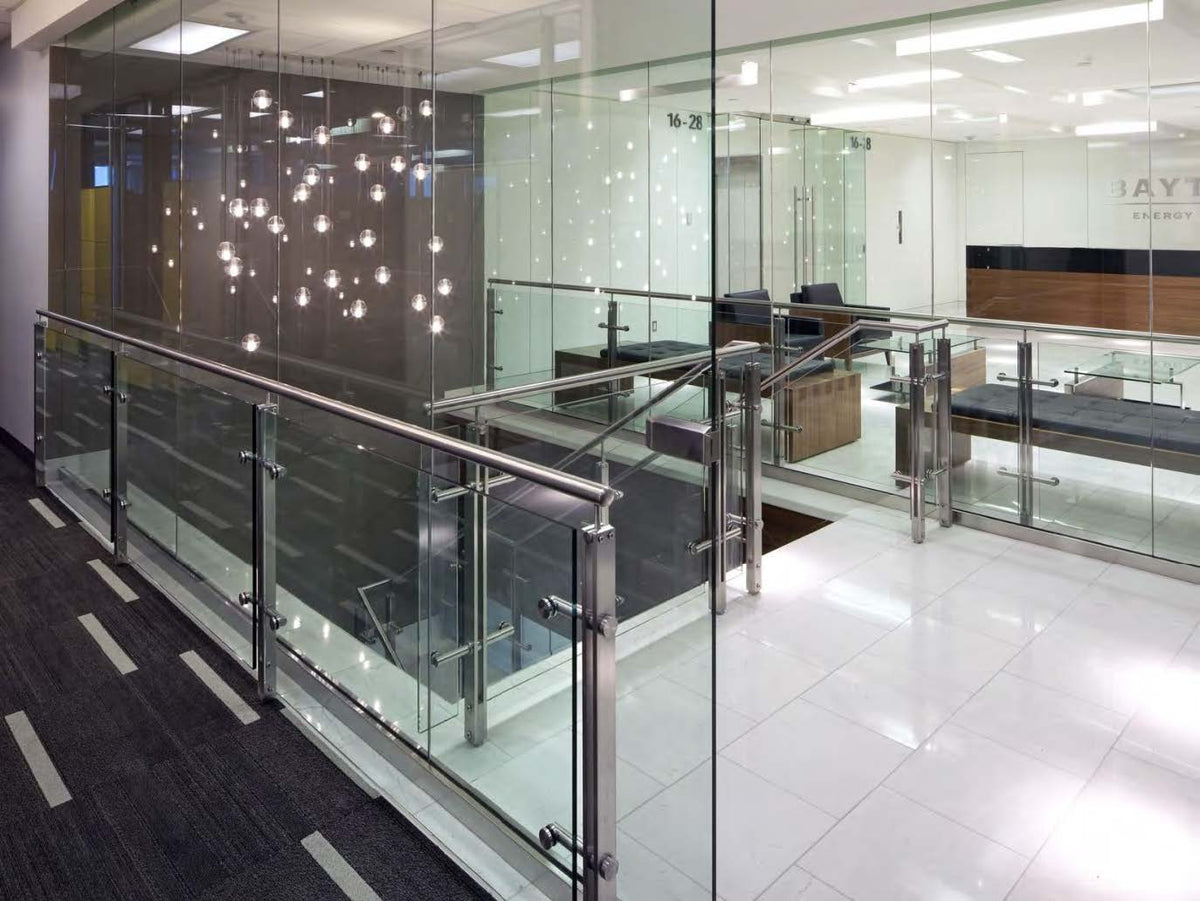 Black Rothnow glass railing with post design, featuring clear safety glass panels for modern outdoor balcony or deck installation.