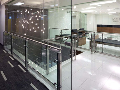 Black Rothnow glass railing with post design, featuring clear safety glass panels for modern outdoor balcony or deck installation.