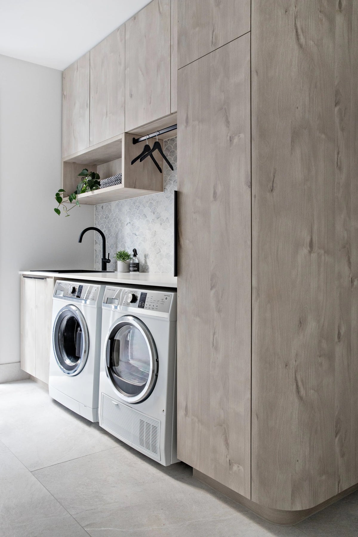 Black Rothnow laundry cabinet RNLC08 with customized size, showcasing sleek storage with doors and interior shelves.