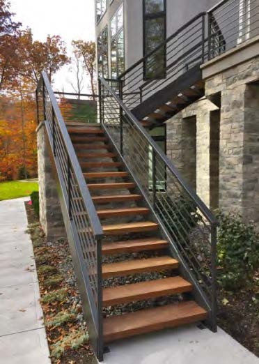 Black Rothnow outdoor staircase with sturdy metal steps and railings, designed for fire escape and exterior building access.