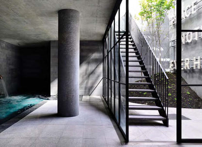 Black Rothnow outdoor staircase with sturdy metal steps and handrails, designed as a fire escape staircase for building safety.