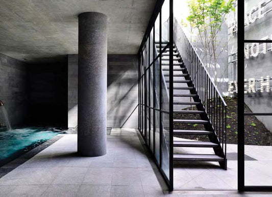 Black Rothnow outdoor staircase with sturdy metal steps and handrails, designed as a fire escape staircase for building safety.