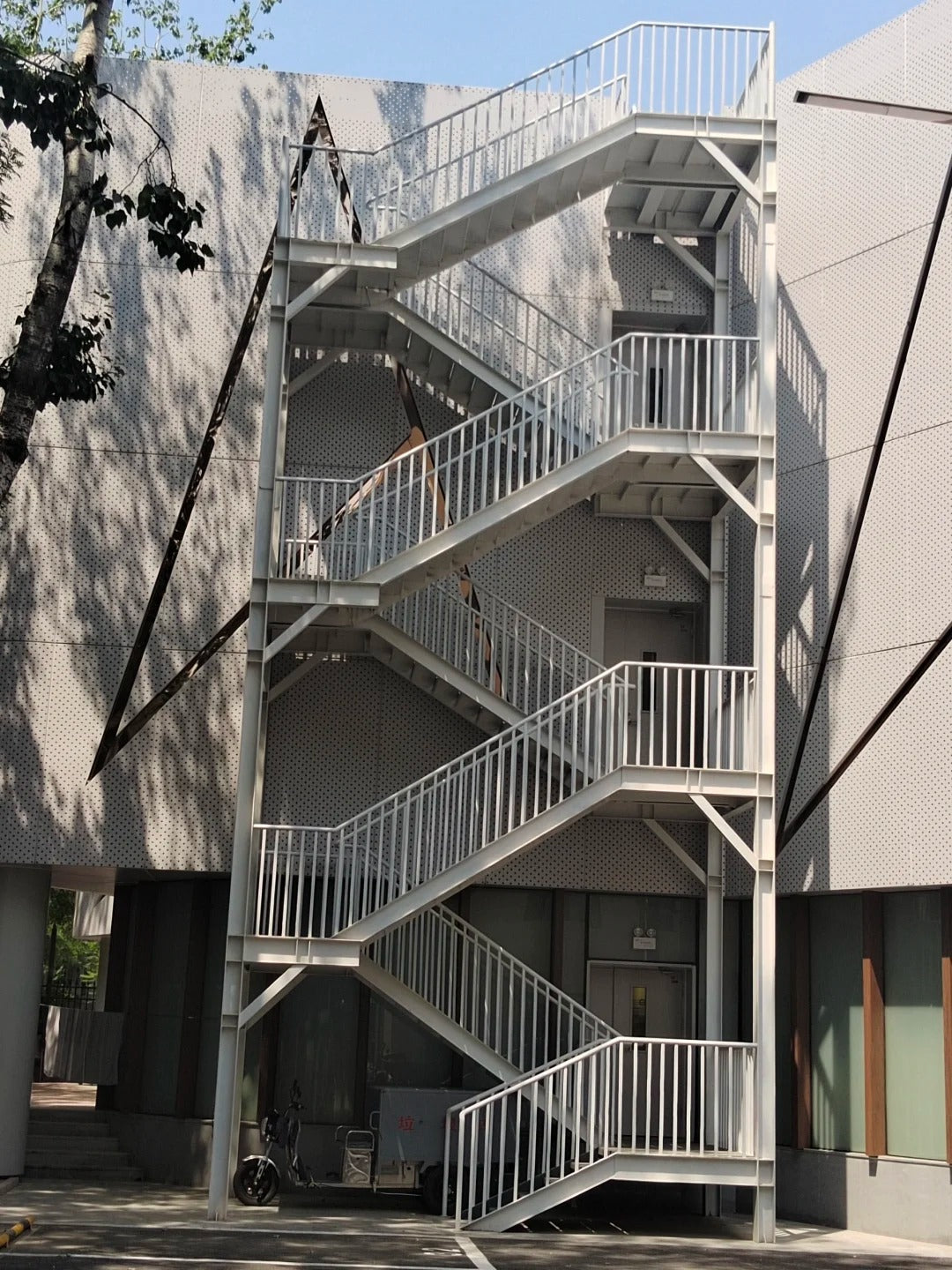 Black Rothnow outdoor staircase with sturdy metal steps and handrails, designed for fire escape and outdoor safety.