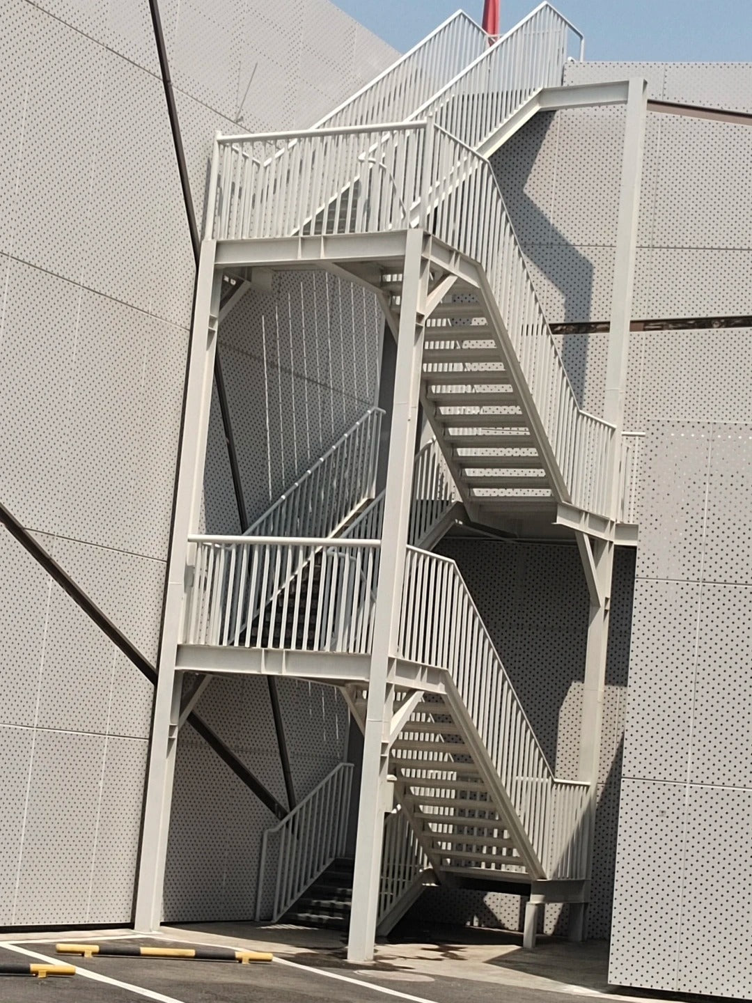 Black Rothnow outdoor staircase with fire escape design, featuring sturdy metal steps and handrails for emergency access.