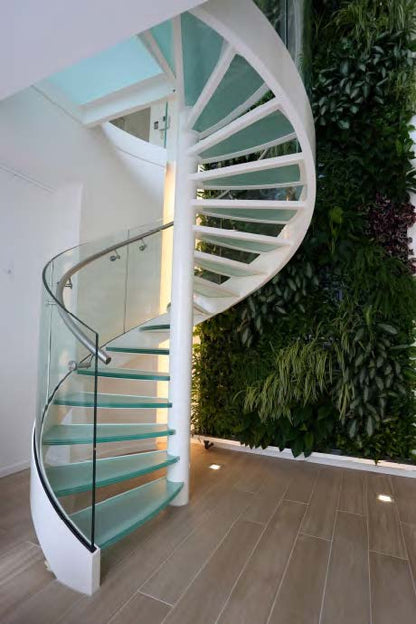 Rothnow Spiral Staircase RNSS01 with black metal frame and glass steps, showcasing a modern, customized design for interior spaces.