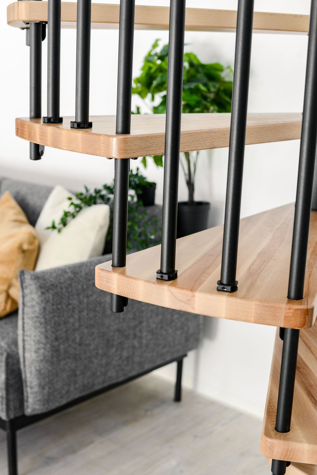 Rothnow® wooden spiral staircase RNSS04 in black, showcasing a custom-sized, elegant staircase design with wood steps.