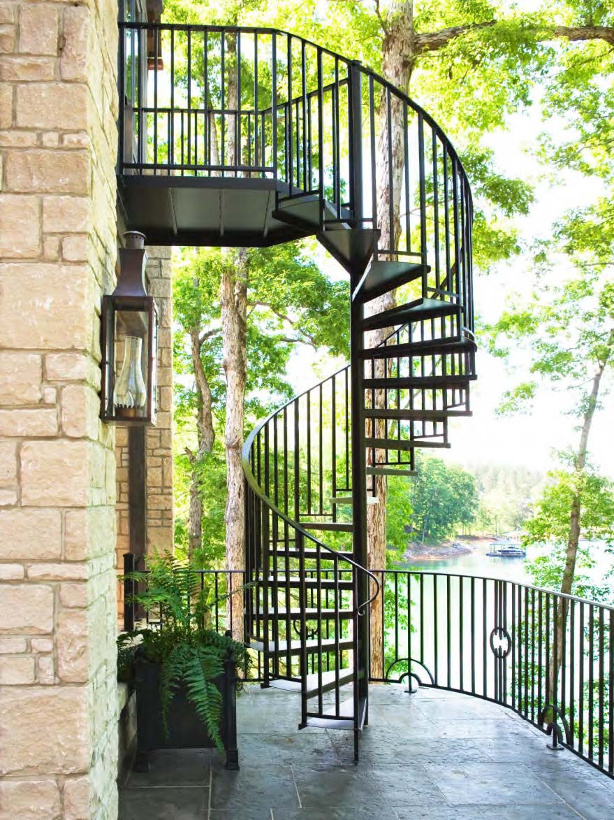 Black Rothnow spiral staircase for outdoor use, made of durable carbon steel, featuring a custom size design and modern railing.
