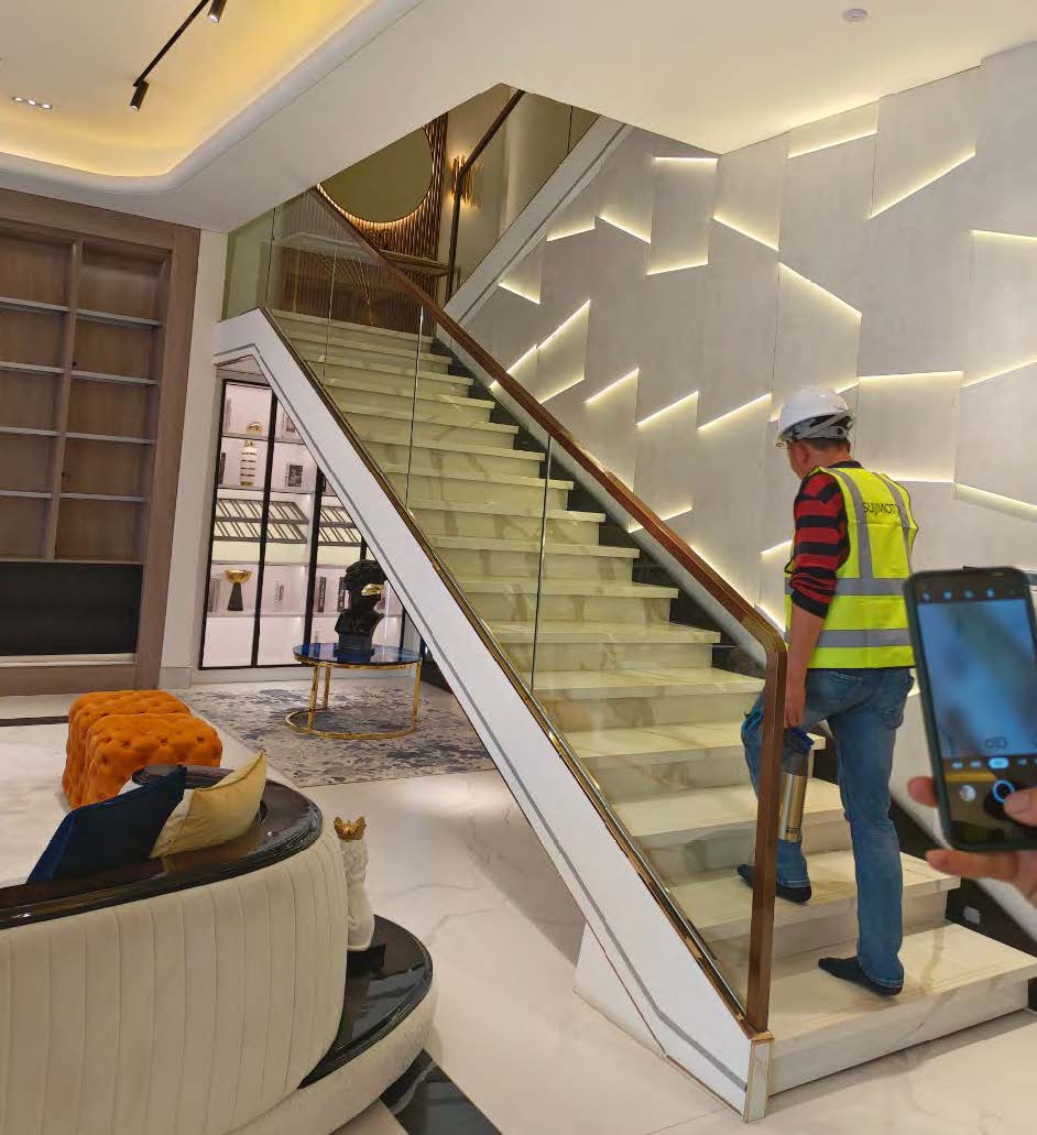 Black Rothnow straight staircase RNSS05 made of stone, featuring sleek, modern design with rectangular steps and sturdy handrails.