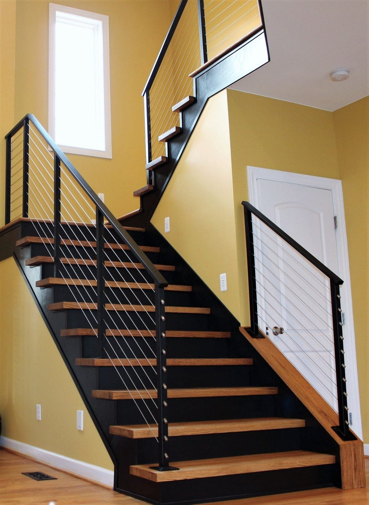 Black Rothnow Wire Cable Railing RNWR07 for staircase, custom-sized, sturdy steel guardrail with sleek cable design.