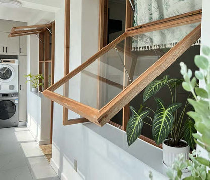 Rothnow® Wooden Awning Window with black finish, custom size, featuring clear glass and traditional window design.