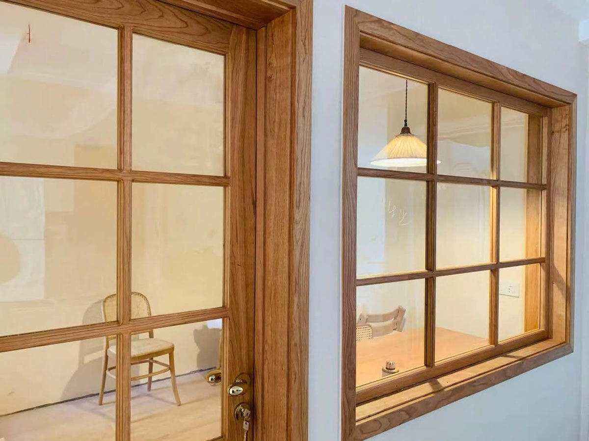 Rothnow® fixed wooden window with black frame, showcasing a sleek, customizable design for modern home interiors.