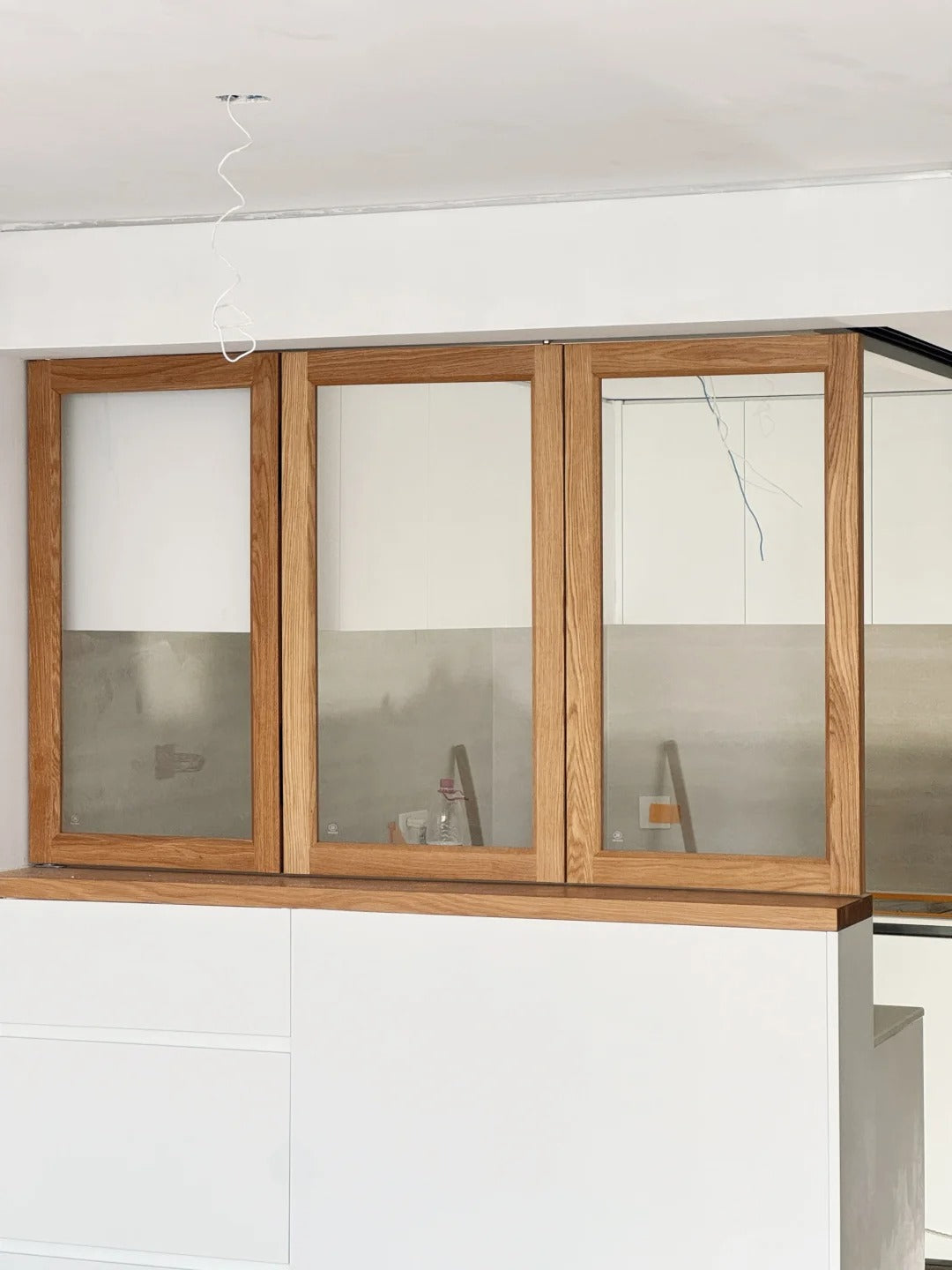 Rothnow® Wooden Folding Window in black, custom-sized, showcasing its elegant wooden frame and folding design.