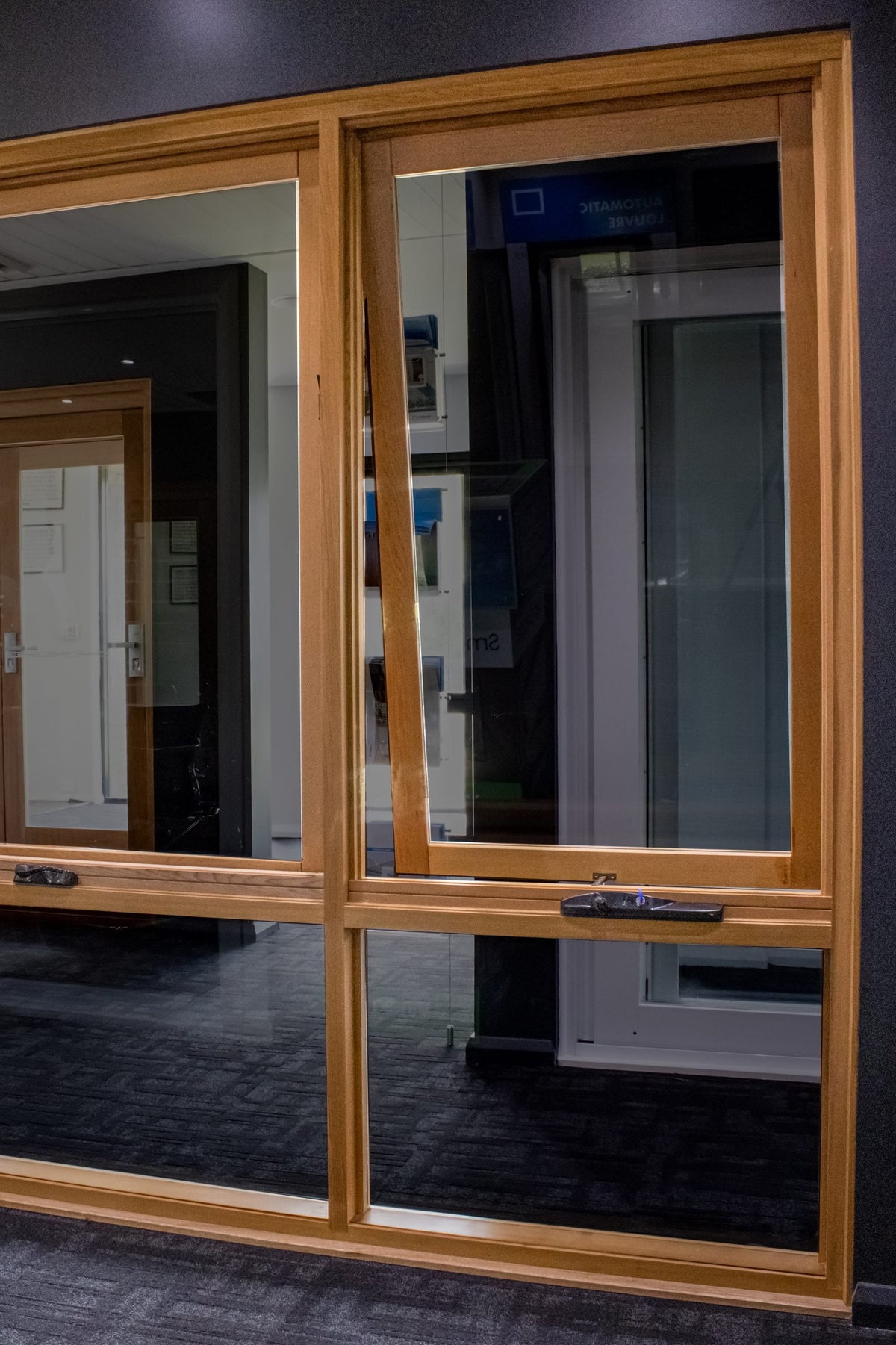 Rothnow® wooden awning window with black finish, custom size, and clear glass, designed for residential ventilation and natural light.