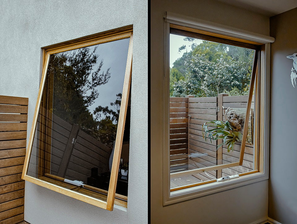 Rothnow® Wooden Awning Window RNWW04, black finish, with clear glass and wooden frame, installed in a modern home.