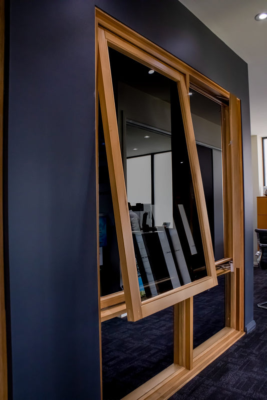 Rothnow Wooden Window RNWW04 Awning Window in black, showcasing a custom-sized, traditional wooden window with open awning design.