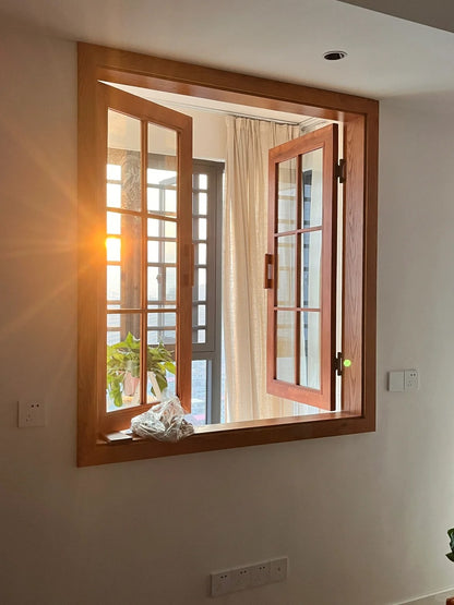 Rothnow® wooden casement window in black, custom-sized, featuring clear glass panes and traditional window design.