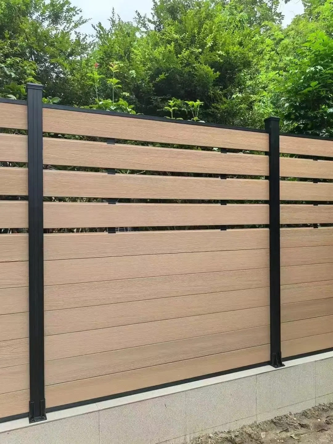 Black Rothnow WPC Fence RNWF01, customizable size outdoor fence showing textured wood-like composite panels and sturdy framework.