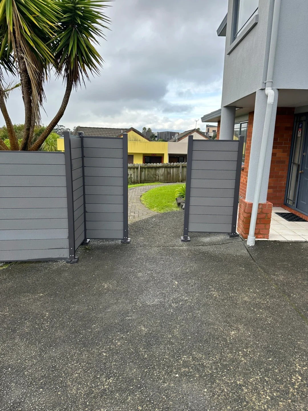 Black Rothnow WPC fence RNWF04 made of composite wood for durable outdoor fencing, shown in a customized size.