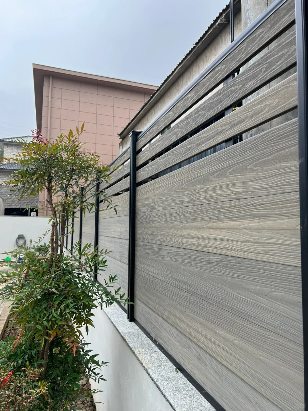 Black Rothnow WPC fence with customized size, showcasing durable composite wood privacy fencing with sleek design.
