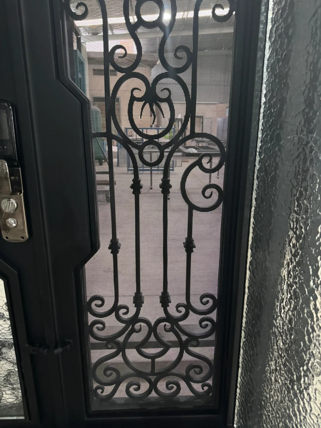 Black Rothnow wrought iron entrance door with customized size, featuring intricate ironwork design for a stylish front entry.