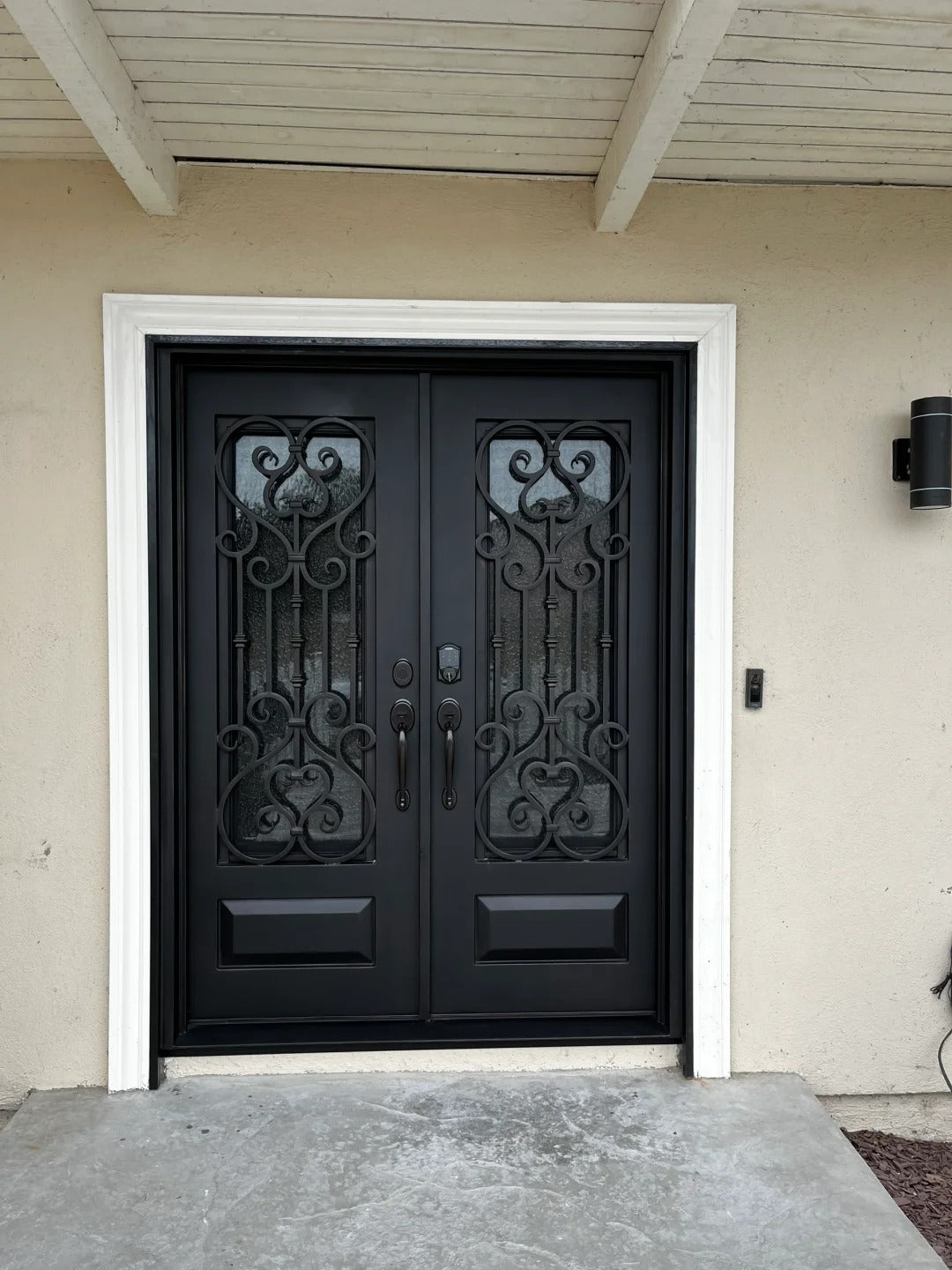 Black Rothnow wrought iron entrance door with intricate design, customized size, suitable for front entryways.