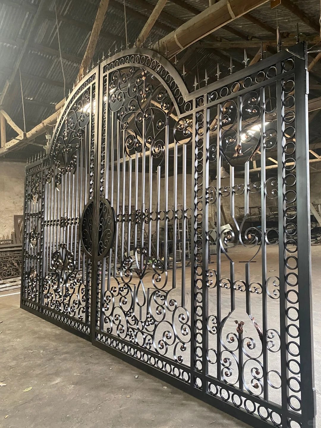 Black Rothnow wrought iron garden gate with decorative scrollwork and custom size, ideal for outdoor security and aesthetic appeal.