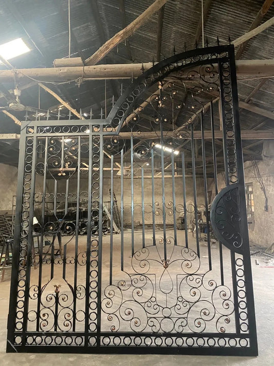 Black Rothnow wrought iron garden gate with decorative scrollwork and sturdy frame, custom-sized for outdoor fencing.