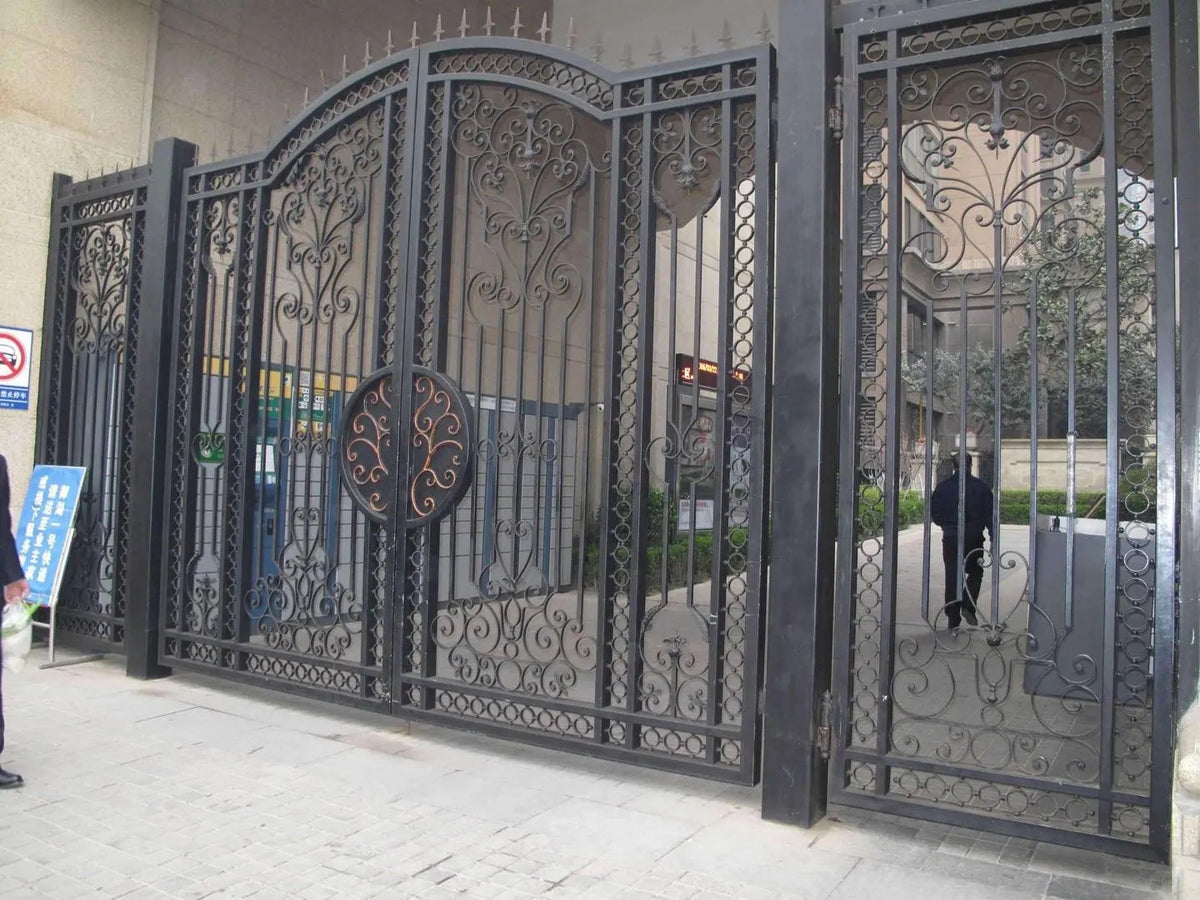 Black Rothnow wrought iron garden gate with intricate scrollwork and durable design, custom-sized for outdoor garden entrances.