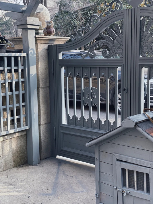 Black Rothnow wrought iron garden gate with decorative scrollwork and custom size for outdoor security and aesthetic appeal.