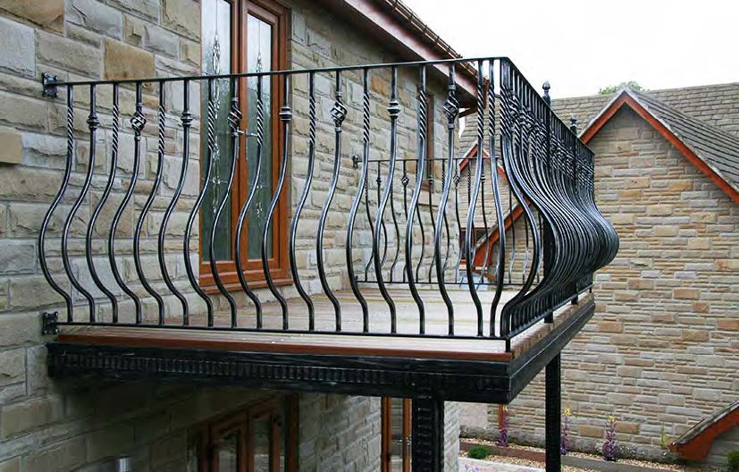 Black Rothnow wrought iron railing and fence with decorative design, custom-sized for outdoor safety and aesthetic enhancement.