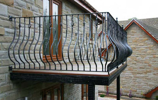 Black Rothnow wrought iron railing and fence with decorative design, custom-sized for outdoor safety and aesthetic enhancement.
