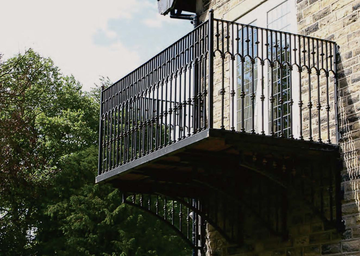 Black Rothnow wrought iron railing with decorative design, suitable for fences and safety barriers, showcasing durable craftsmanship.