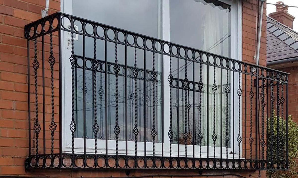 Black Rothnow wrought iron railing with decorative vertical bars and horizontal top rail, suitable for fences and outdoor safety.