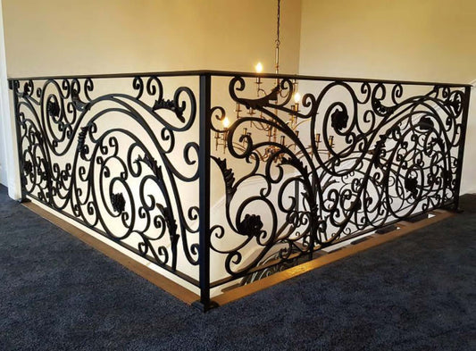 Black Rothnow wrought iron railing with decorative design, custom-sized fencing for outdoor safety and aesthetic enhancement.